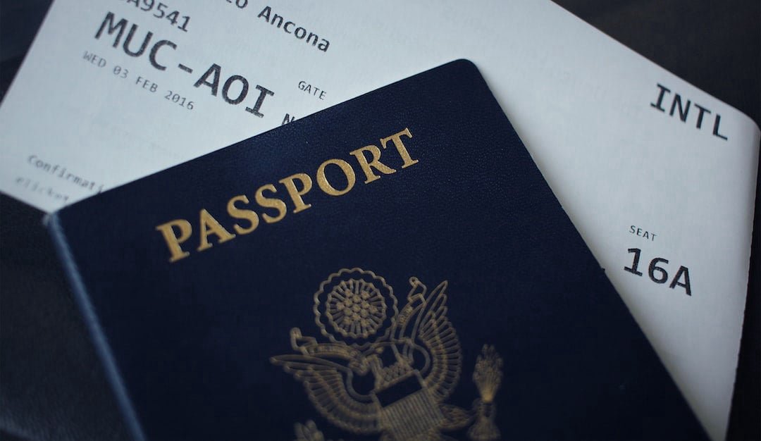 Traveler walking through a bright airport terminal